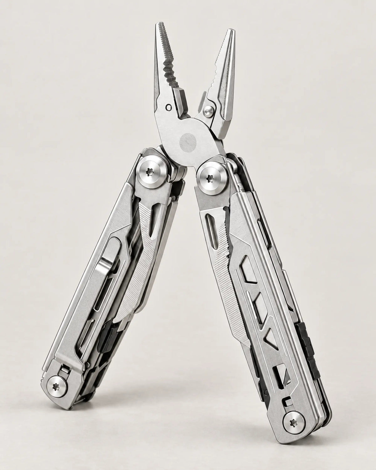 Silver 16-in-1 folding multi-tool in a right three-quarter studio view with its built-in tools folded.