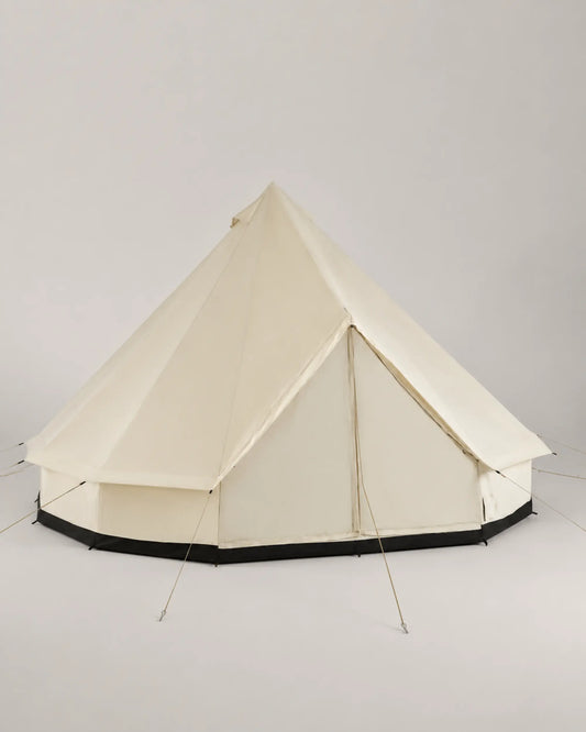 Beige bell tent from the left three-quarter angle with guy ropes and black base