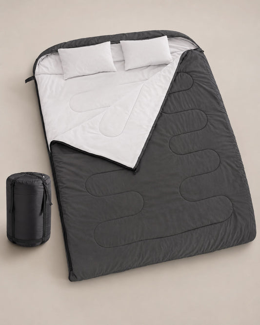 Angled studio view of black double sleeping bag with rectangular shape and zip-around construction.