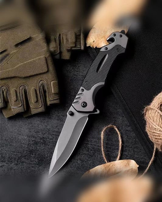 KK5 plain-blade folding knife arranged with outdoor field gear