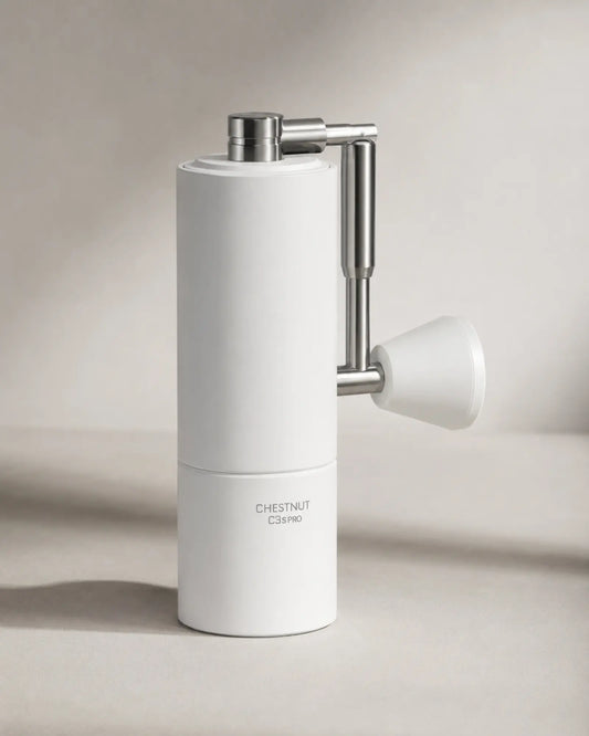 White TIMEMORE C3S Pro hand coffee grinder shown from the left angle