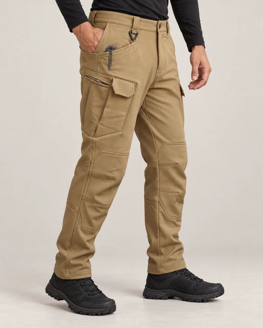 Three-quarter view of khaki fleece-lined tactical pants showing zip and flap thigh pockets