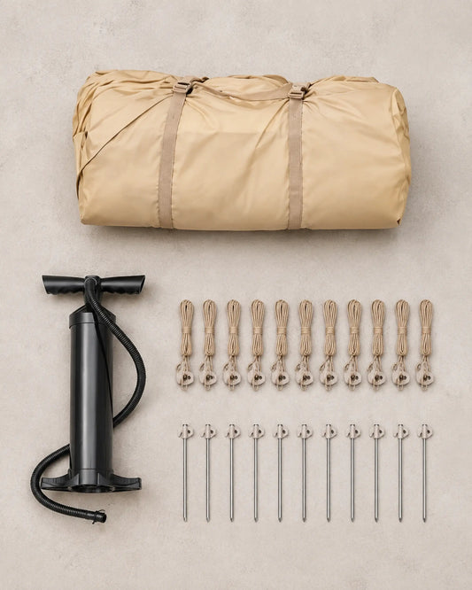 Packed khaki inflatable tent with hand pump, guy lines and stakes