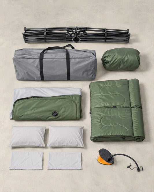 Two-person camping cot set with folded frame, mattress, bedding, pump and carry bag