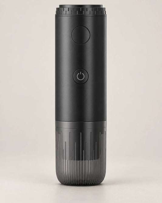 Black 3-in-1 portable electric espresso maker shown from the front on a warm stone-grey background.