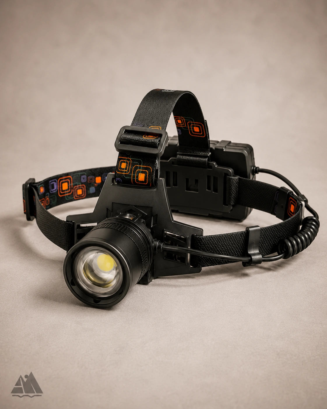 Aluminum LED headlamp angled left view showing lens and headband