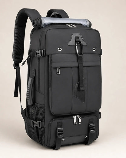 Black travel backpack, left three-quarter view showing the side carry handle