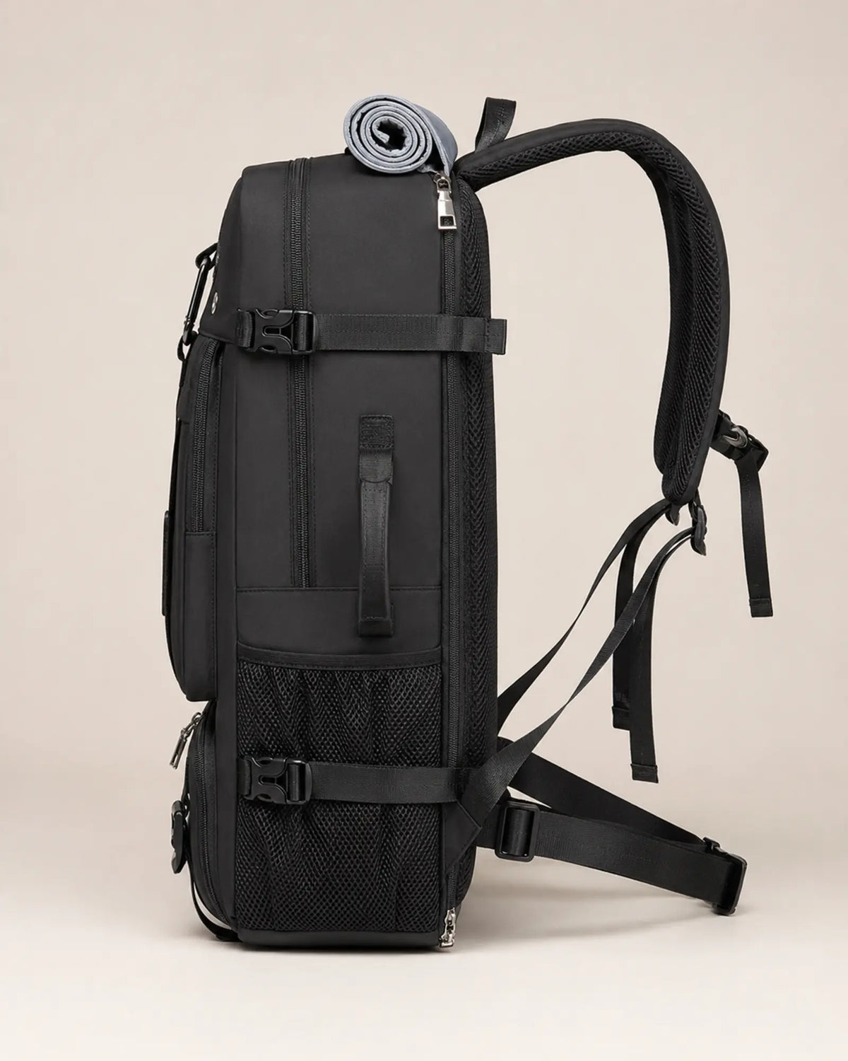 Black 55L expandable travel backpack shown in full side profile
