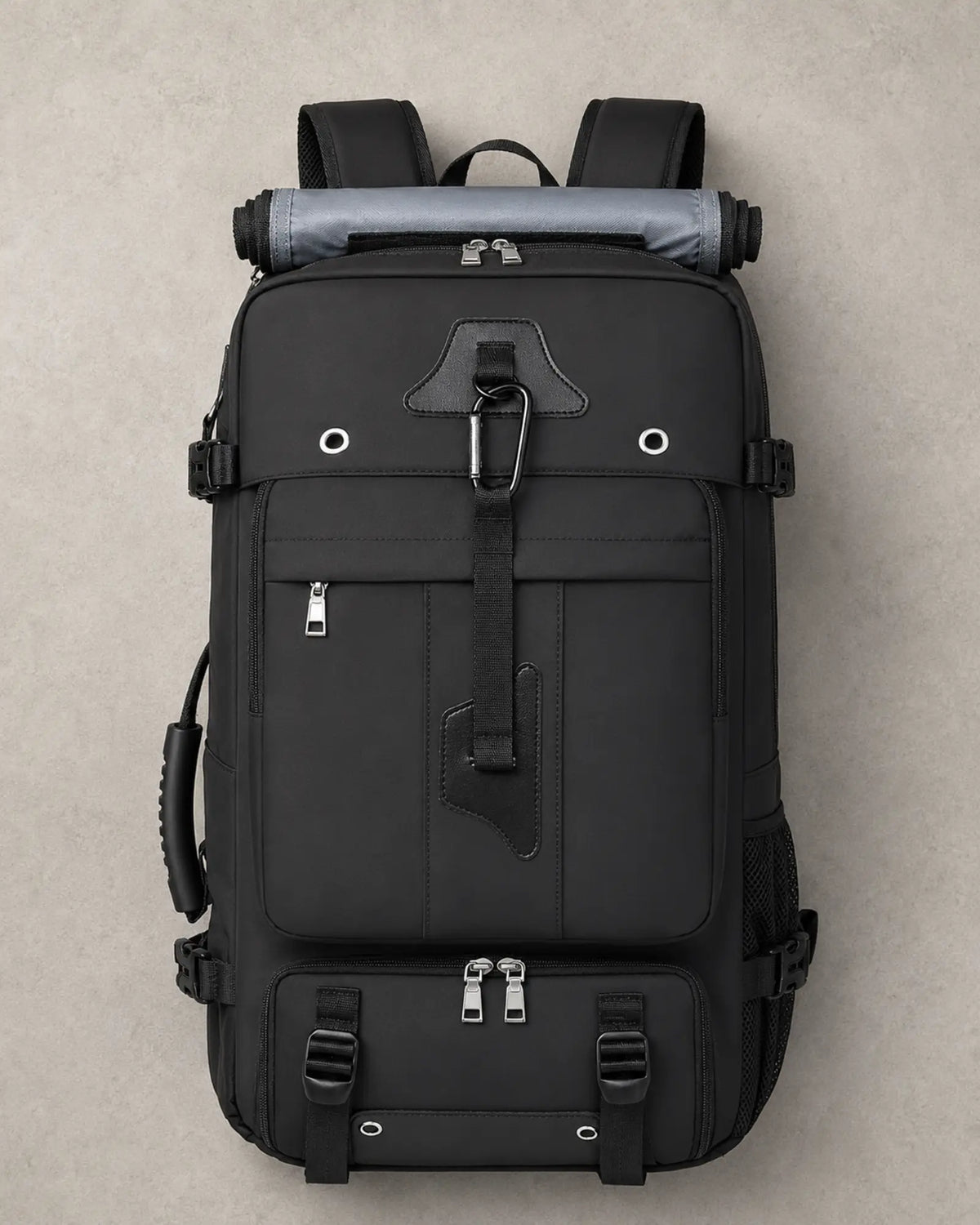 Top-down view of a black expandable travel backpack