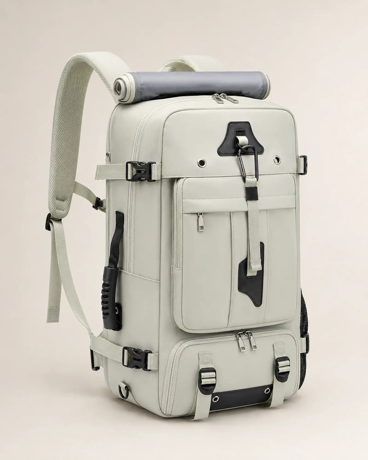 Green travel backpack, left three-quarter view showing the side carry handle