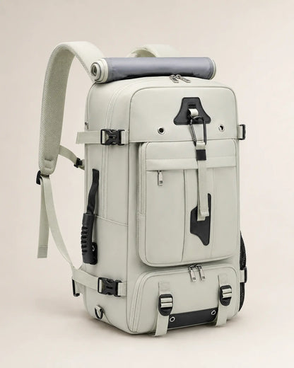 Green travel backpack, left three-quarter view showing the side carry handle