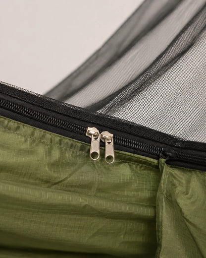 Close-up of the ArmyGreen ripstop seam, black zipper, and mesh binding