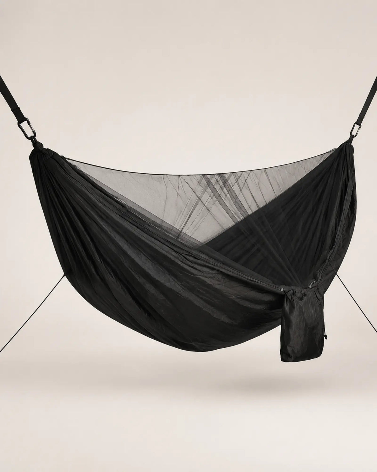 Black mosquito-net camping hammock shown from the left three-quarter angle
