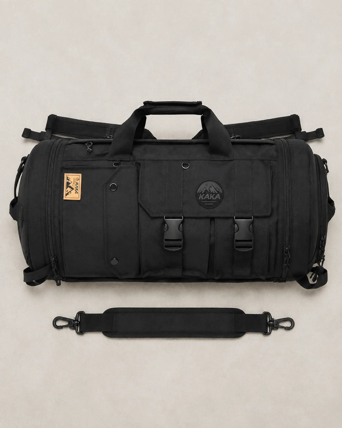 Black multi-carry travel bag and detachable shoulder strap arranged flat