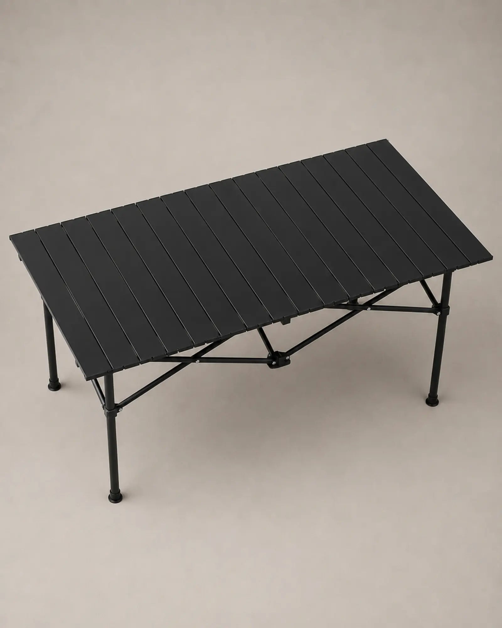 Elevated view of the black slatted camping table surface