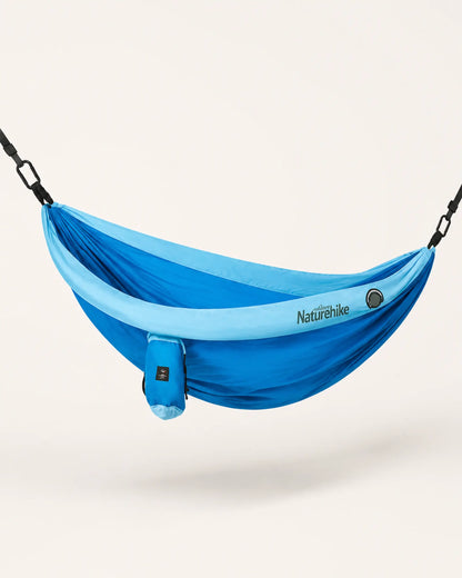 Blue double camping hammock shown from the left three-quarter studio angle