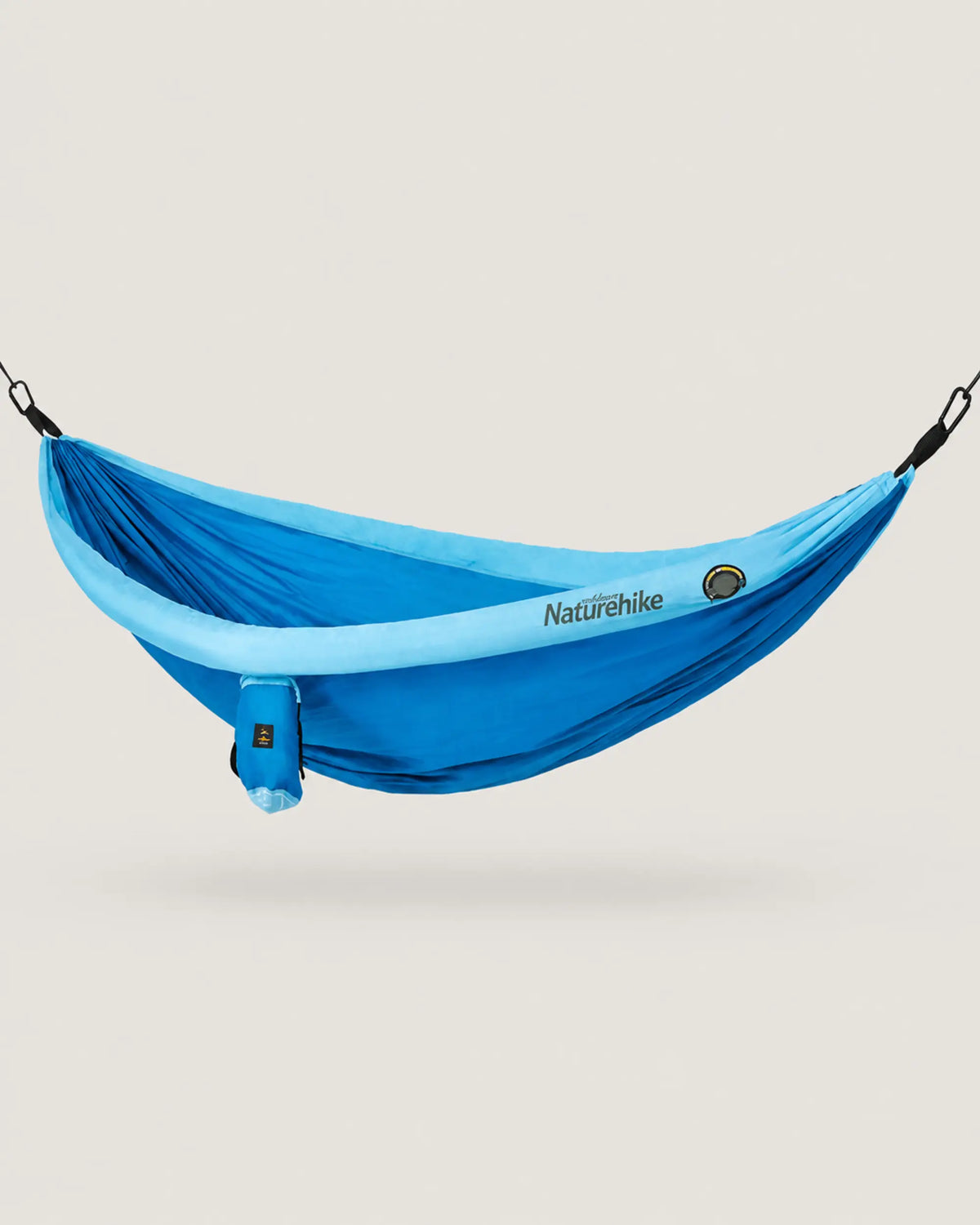 Full side profile of the blue double camping hammock with matching storage pouch