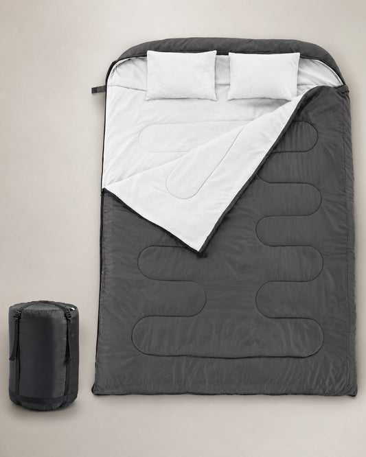 ARWE black double sleeping bag for two adults with white lining, two pillows and a compact compression storage sack.