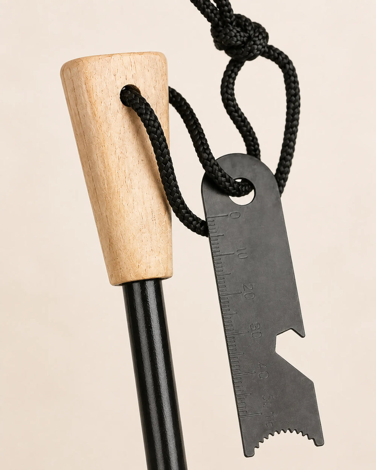 Close view of the ARWE diamond-shaped wood handle, lanyard and striker edges