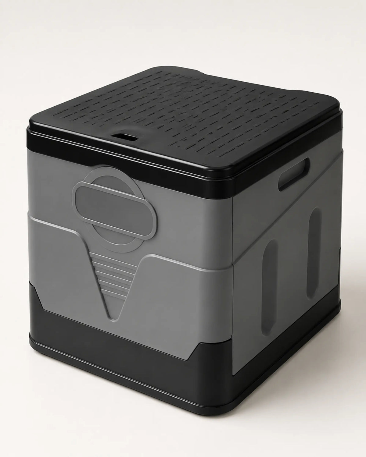 Grey foldable portable camping toilet fully assembled with the ribbed black lid closed in a front view