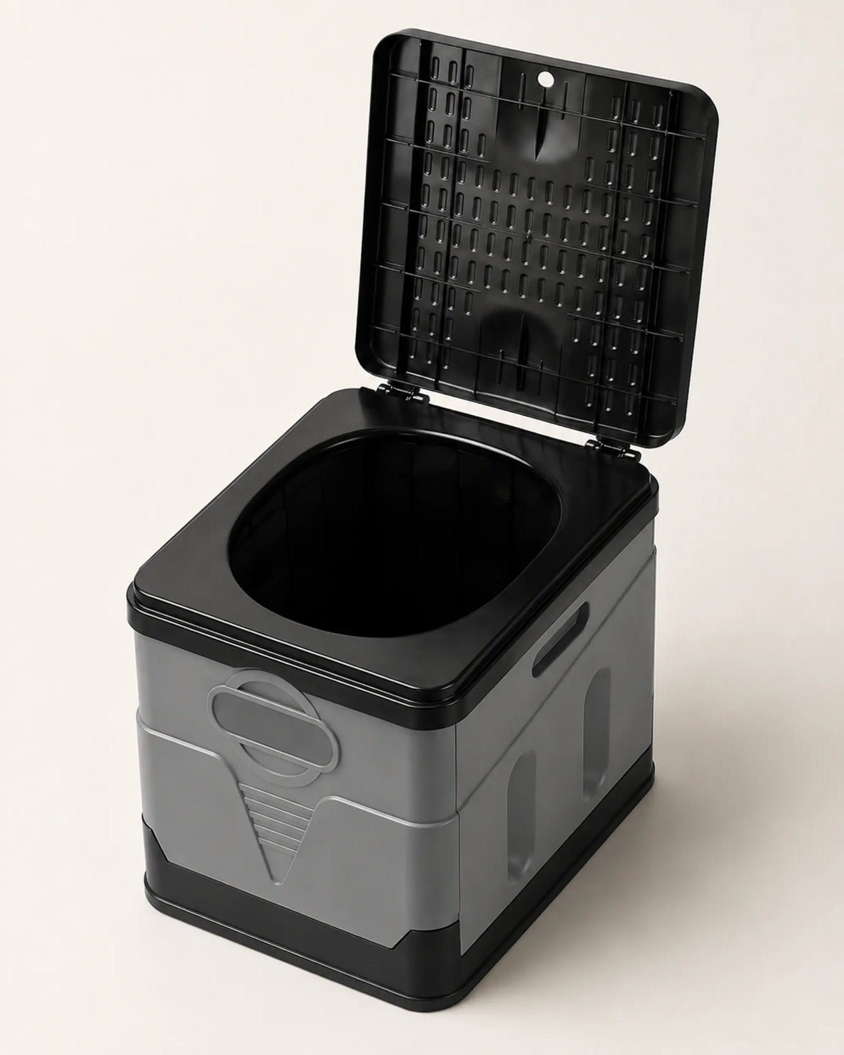 Top-down view of the grey portable camping toilet with raised lid and clean oval seat opening