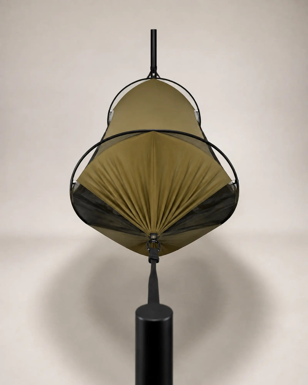 End profile of the suspended olive camping hammock and mesh enclosure