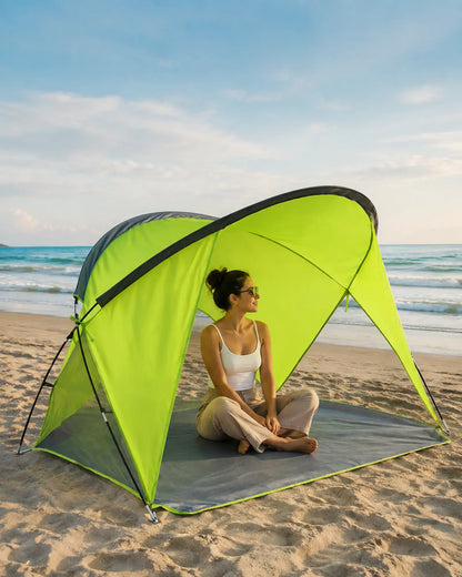 Traveler relaxing inside the Green beach shelter beside the ocean