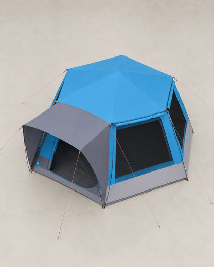 Elevated view of the blue family tent showing its broad roof and footprint