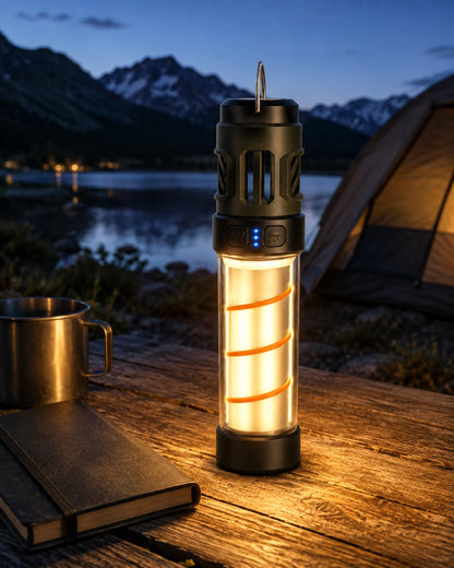 Illuminated AH06 LED camping lantern beside an alpine lake at twilight