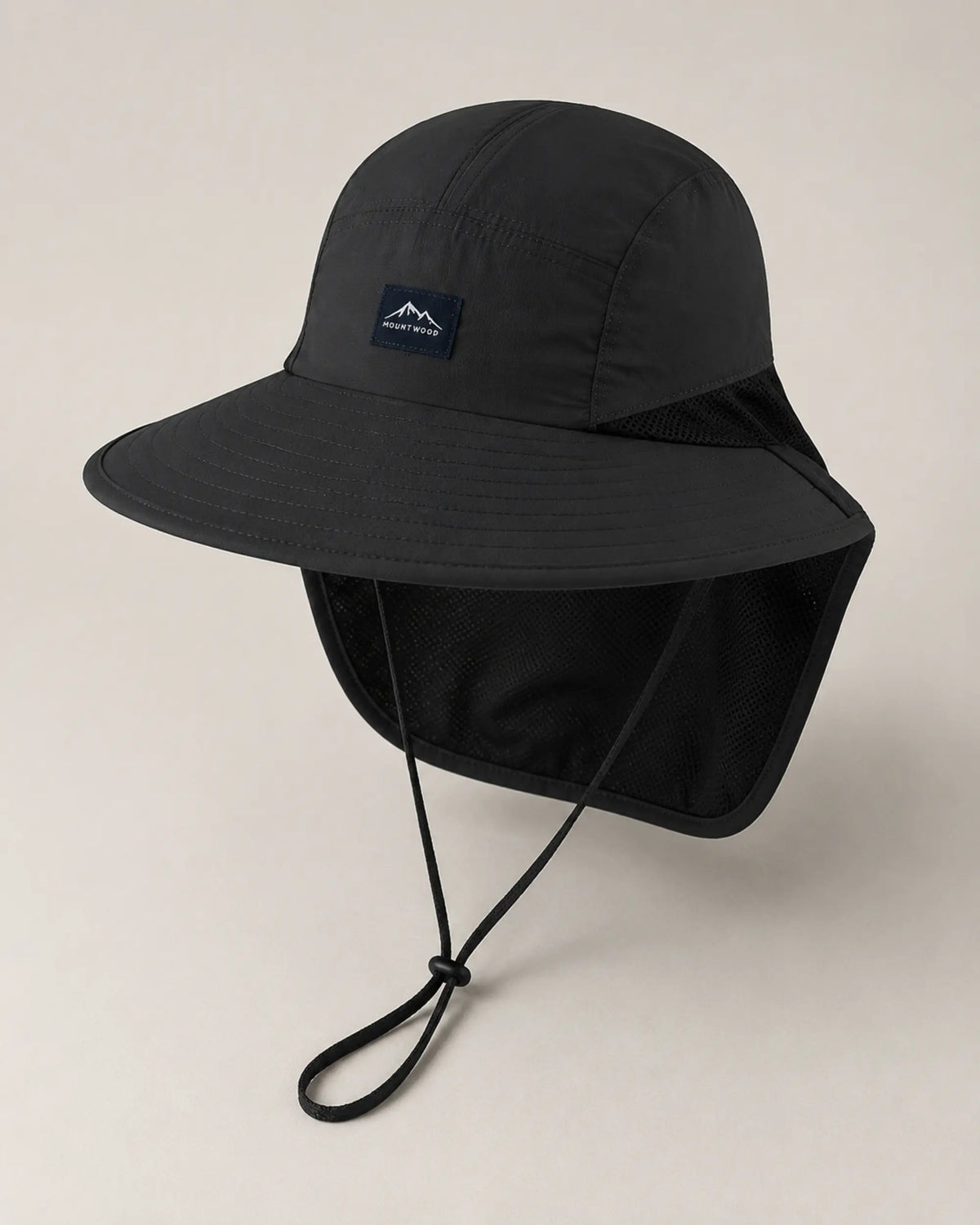 Elevated view of black sun hat highlighting crown panels and stitched brim