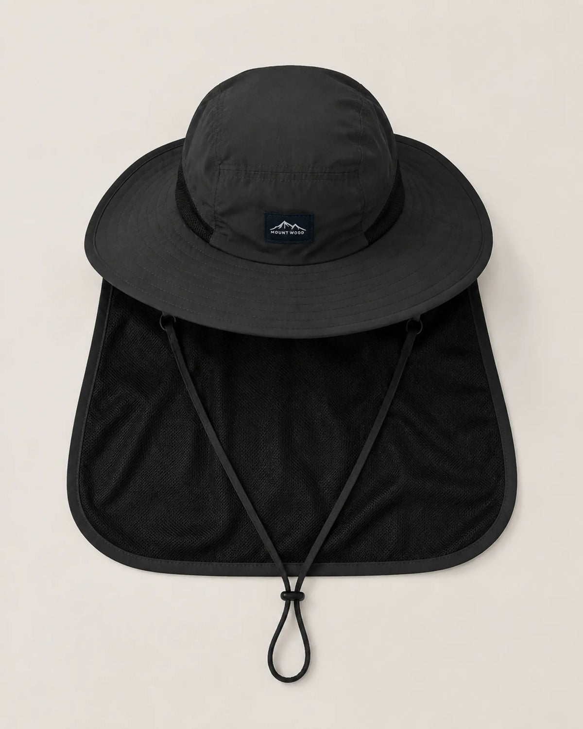 Top-down flat lay of black sun hat with brim, neck flap and chin cord