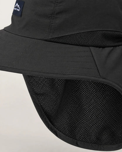 Macro detail of black sun hat ventilation mesh, stitching and bound neck flap