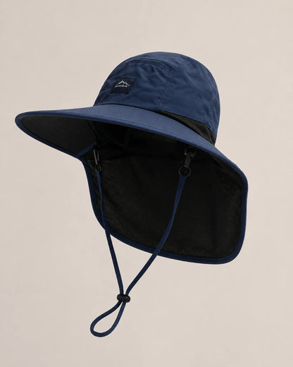 Dark blue neck-flap sun hat shown from a left three-quarter studio angle