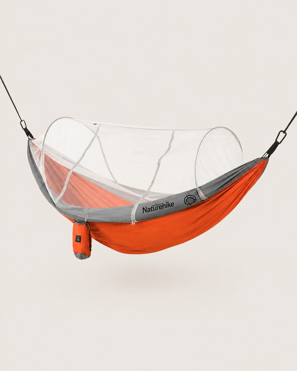 Orange double camping hammock with white tunnel mosquito net deployed