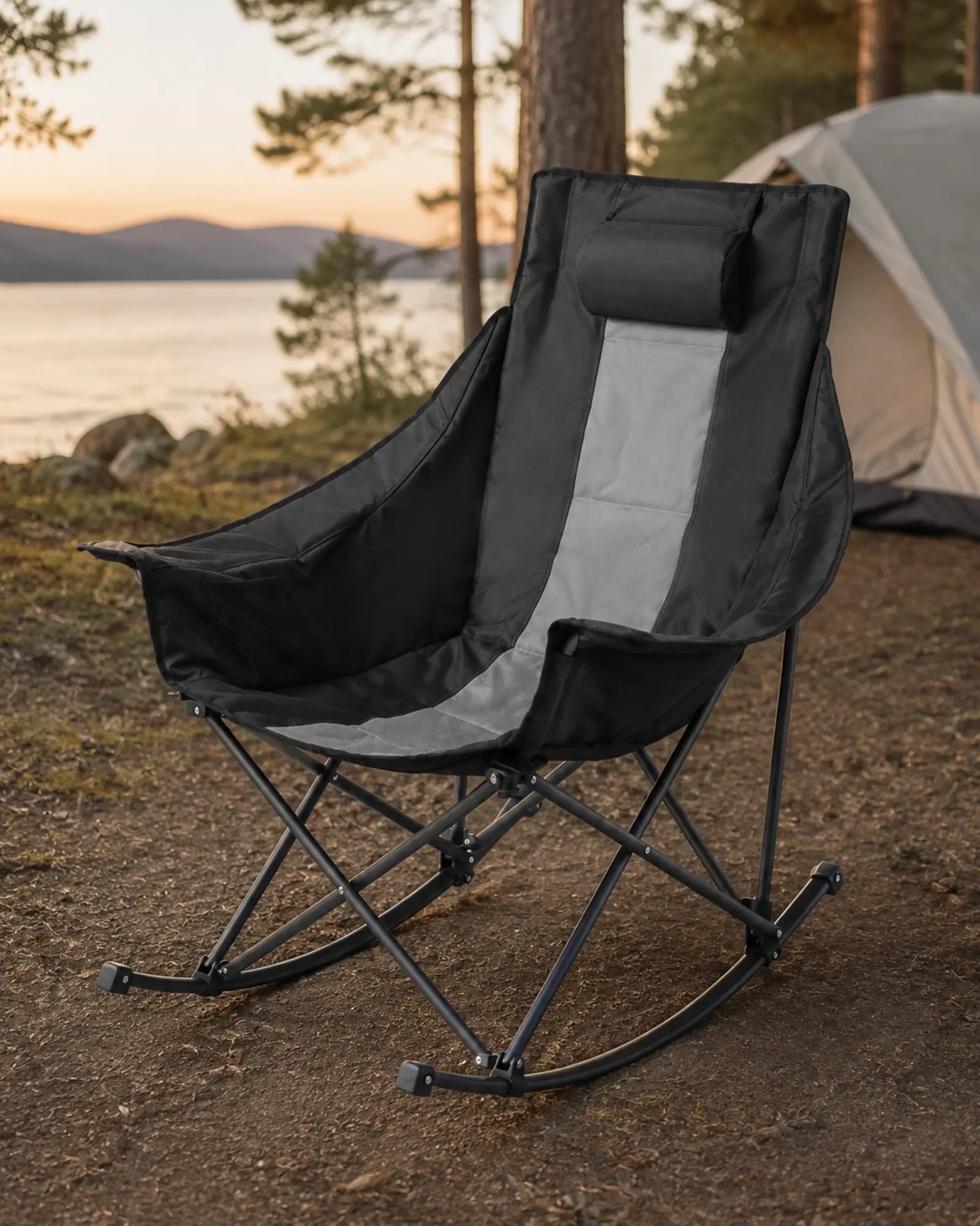 Black and grey padded camp rocker in a natural outdoor setting