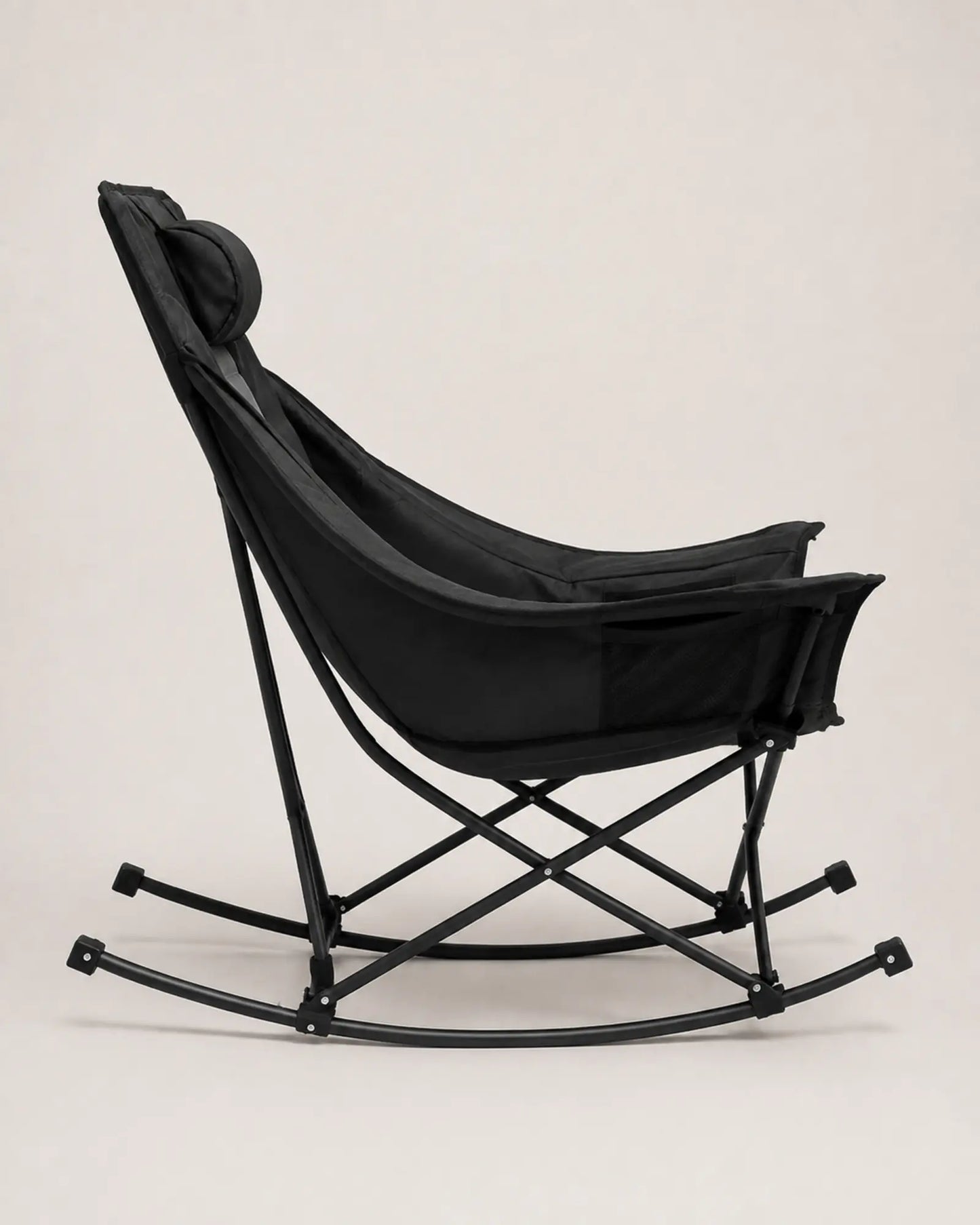Black and grey camping rocker showing its curved side profile
