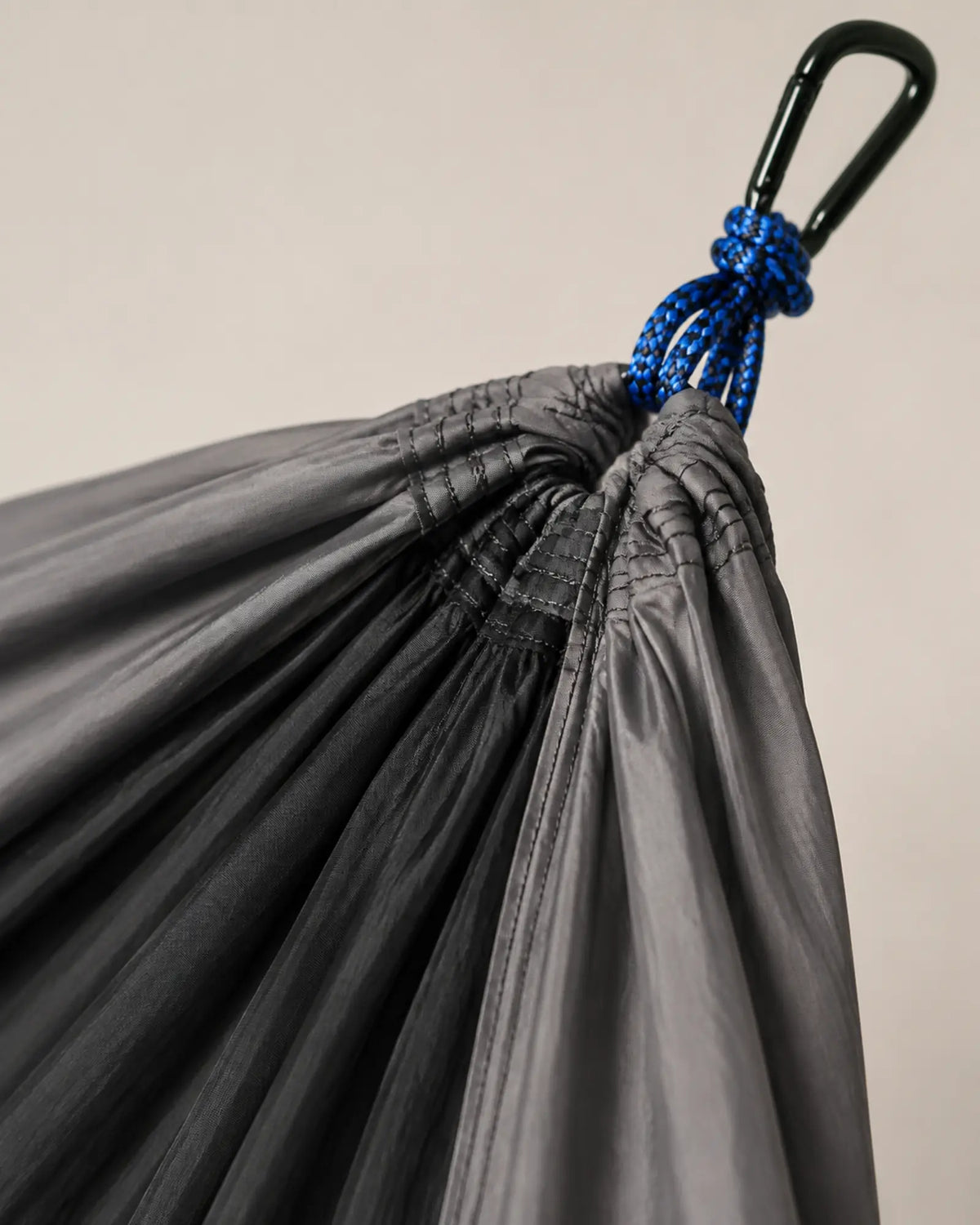 Close-up of reinforced nylon seams and blue cord suspension connection