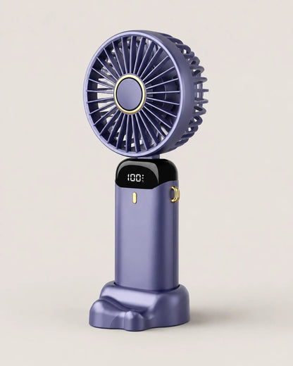Blue portable fan shown from left three-quarter angle on stone-grey backdrop