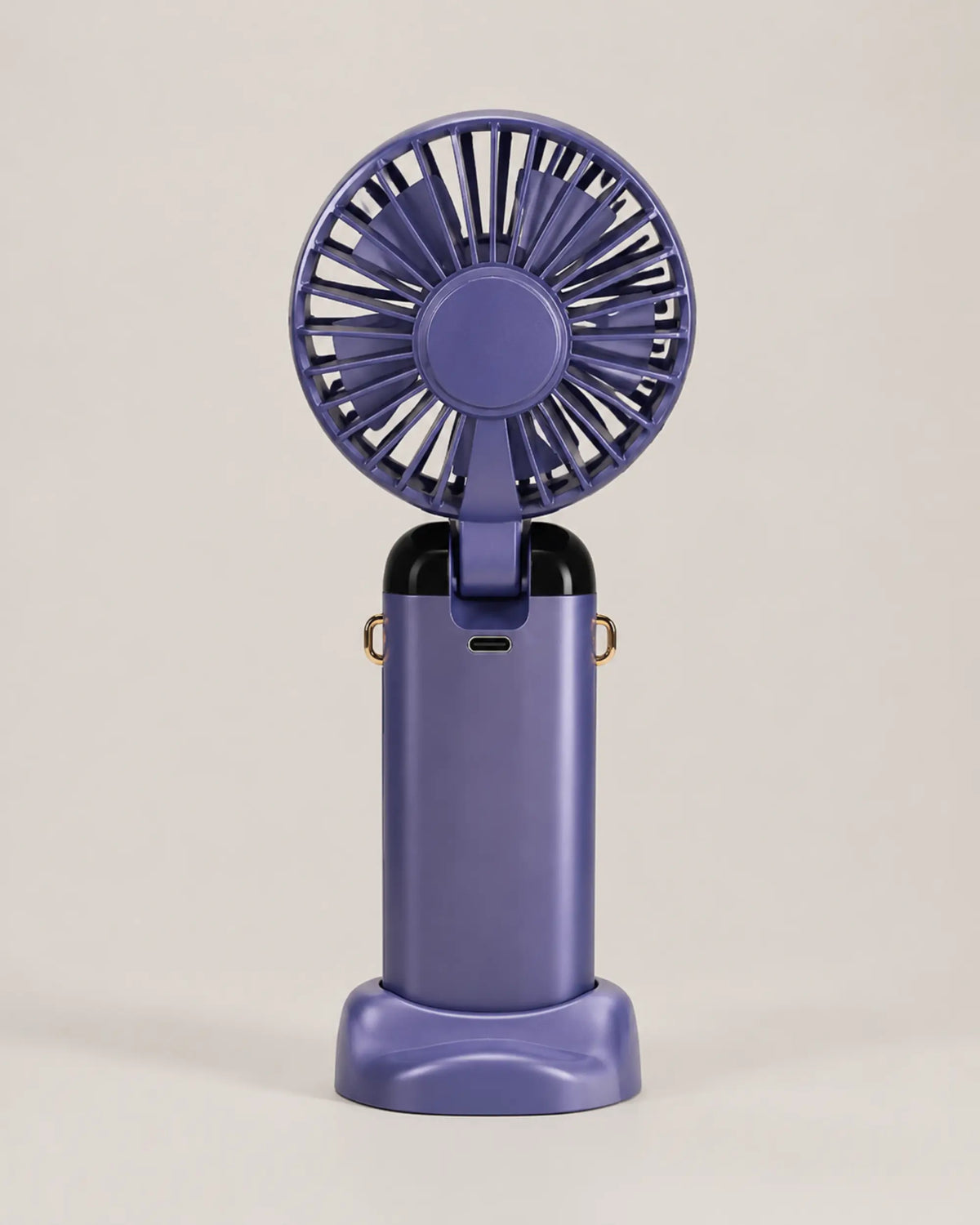 Blue portable fan rear view showing grille, hinge, and USB charging port