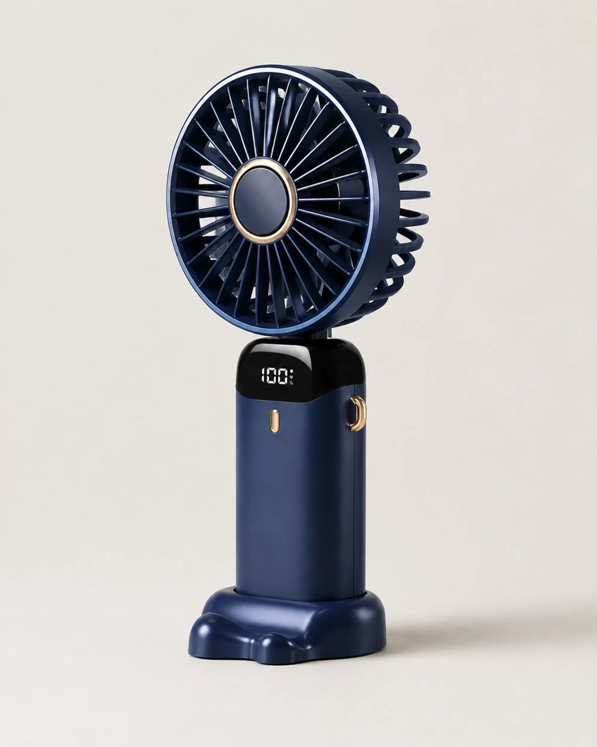 Navy Blue portable fan three-quarter view showing dark body and grille depth