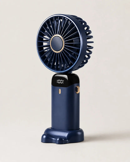 Navy Blue portable fan three-quarter view showing dark body and grille depth