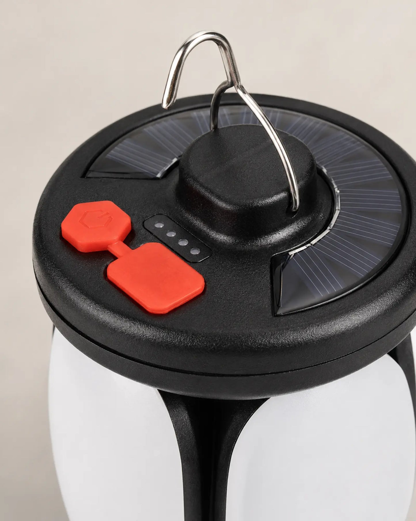 Solar charging panel and USB controls on four leaf camping lantern