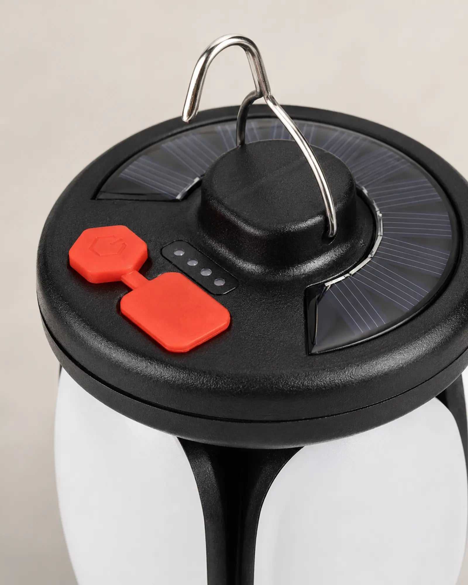 Solar charging panel and USB controls on four leaf camping lantern