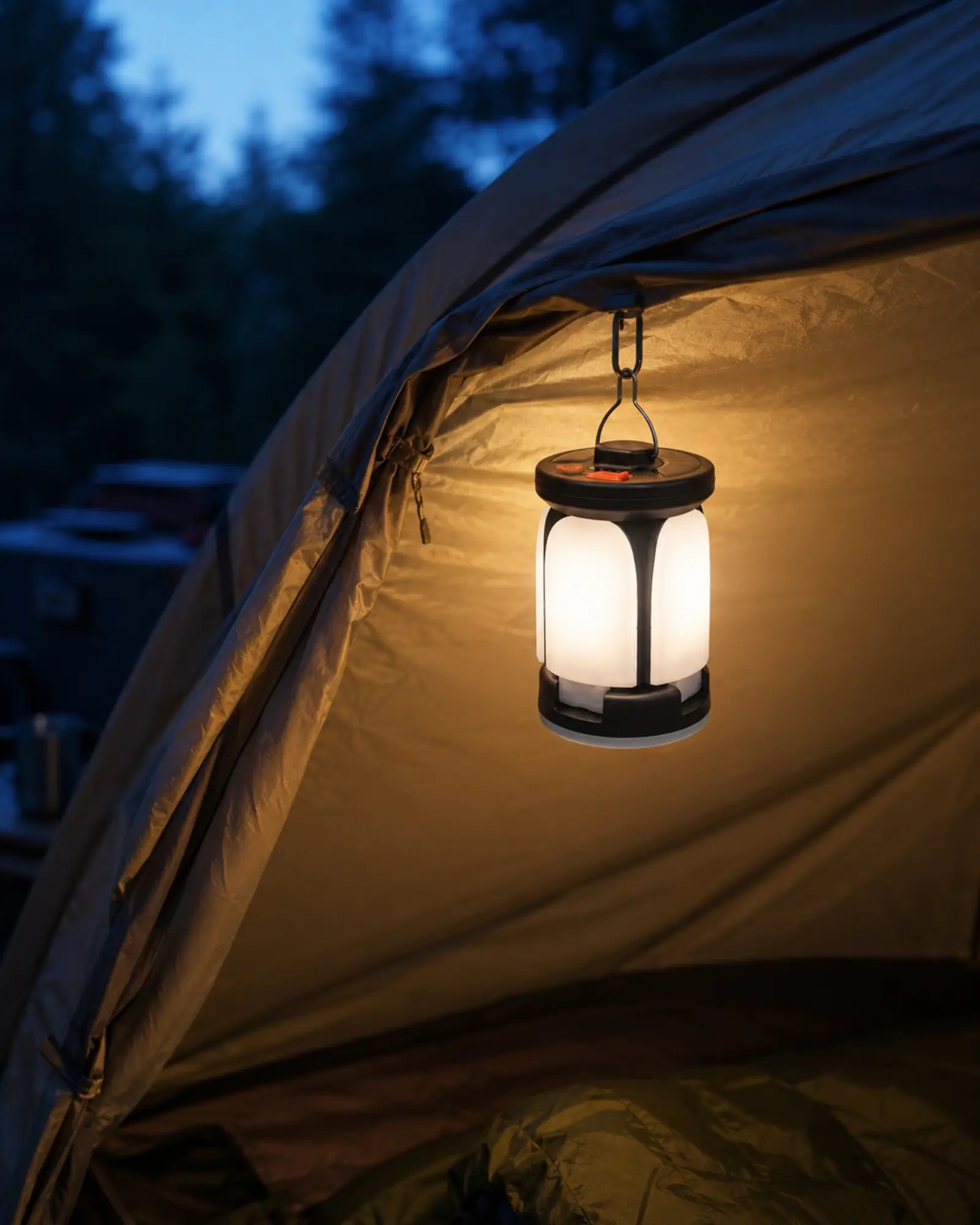 Four leaf rechargeable lantern hanging inside a forest campsite tent