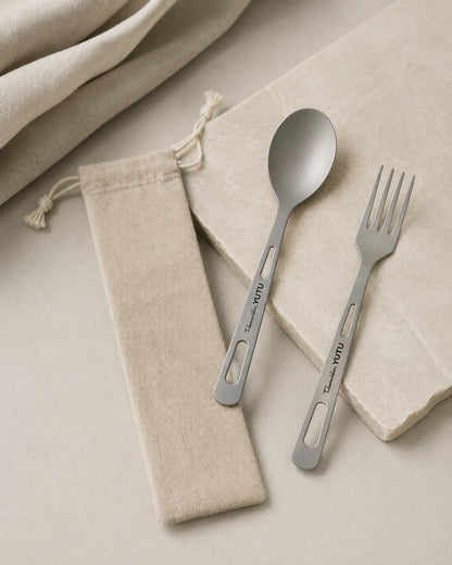 Editorial ARWE titanium spoon fork and linen pouch on pale stone