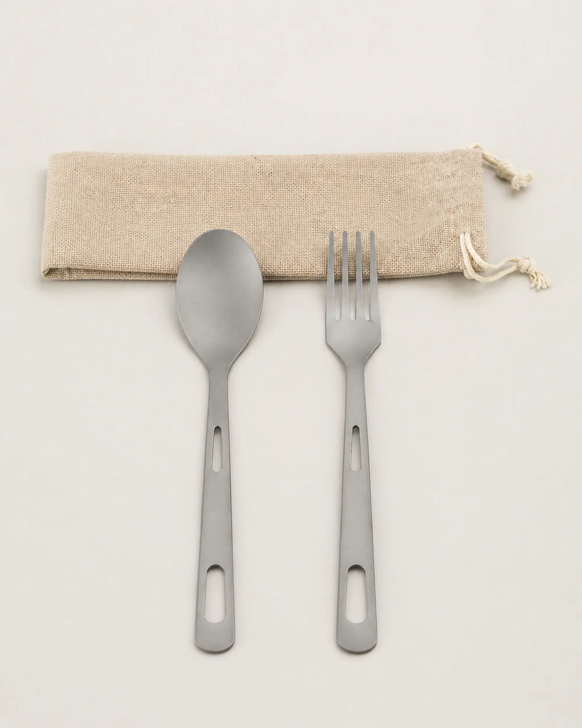 Reverse view of ARWE titanium spoon and fork with linen pouch
