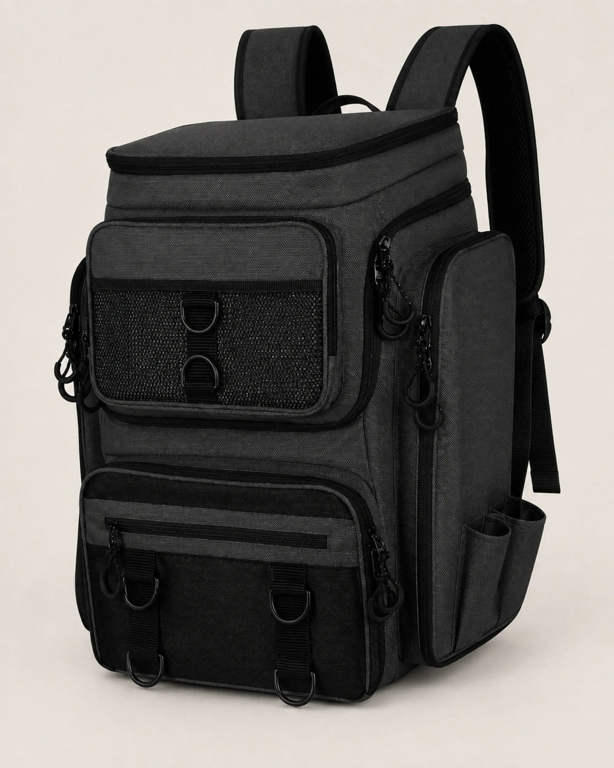 Black water-resistant fishing tackle backpack in a front three-quarter studio view