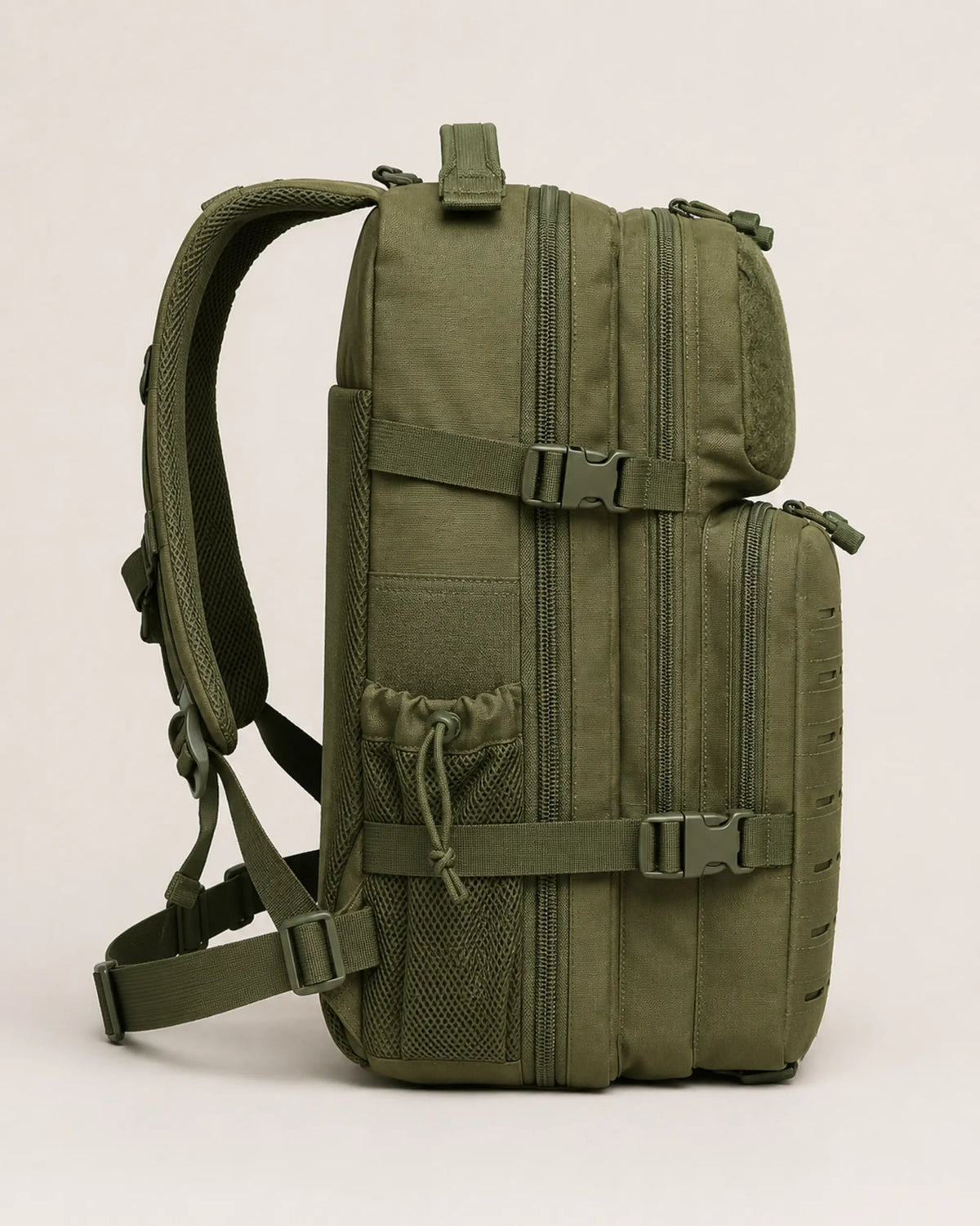 Army green tactical backpack side profile showing layered compartments and padded straps