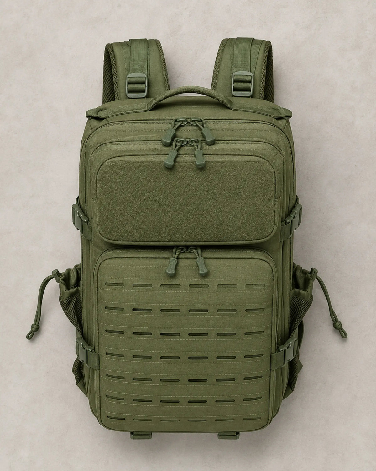 Top view of closed army green tactical backpack with multiple zipper compartments