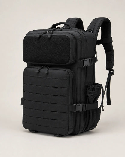 Black tactical backpack angled view showing layered zippers and compression straps